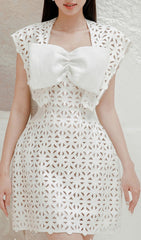 Chic White Laser-Cut Mini Dress with Oversized Bow Detail