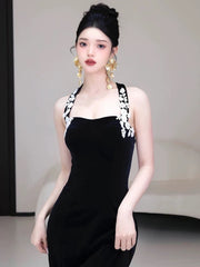 Vestido de fiesta largo de sirena de terciopelo negro con cuello halter