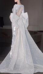 Cyma Glamorous Sequin Mermaid Gown with Dramatic Bow & Long Sleeves