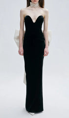 Elegant Black Strapless Bustier Maxi Gown with Dramatic White Bow Back
