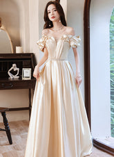 Vestido de fiesta largo con hombros descubiertos y satén color champán