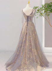 Hermoso vestido formal largo con escote en V y cordones en color champán y gris