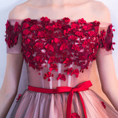 Vestido de fiesta de tul rosa con flores y corte alto bajo