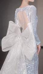 Cyma Glamorous Sequin Mermaid Gown with Dramatic Bow & Long Sleeves