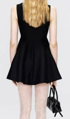 Elegant Black Sleeveless Mini Dress with Ornate Lace Collar