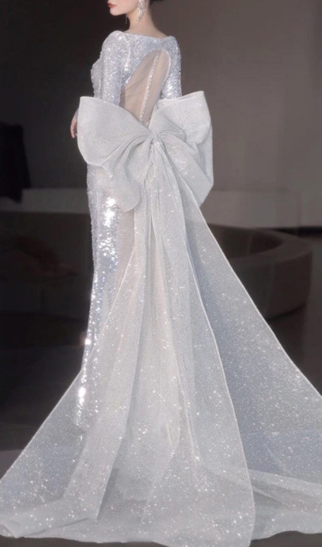 Cyma Glamorous Sequin Mermaid Gown with Dramatic Bow & Long Sleeves