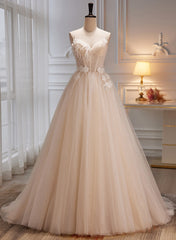 Vestido de fiesta con tirantes de tul color marfil y flores 