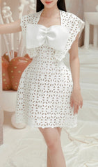 Chic White Laser-Cut Mini Dress with Oversized Bow Detail