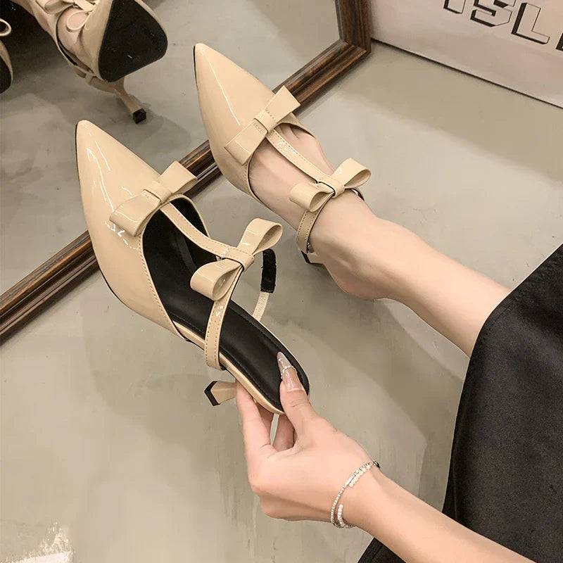 Beautiful peach-colored high-heeled thin slippers