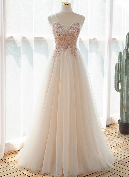 Hermoso vestido de fiesta de tul color marfil con escote en V y largo hasta el suelo 
