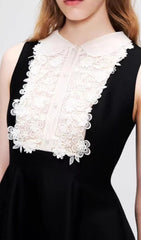 Elegant Black Sleeveless Mini Dress with Ornate Lace Collar